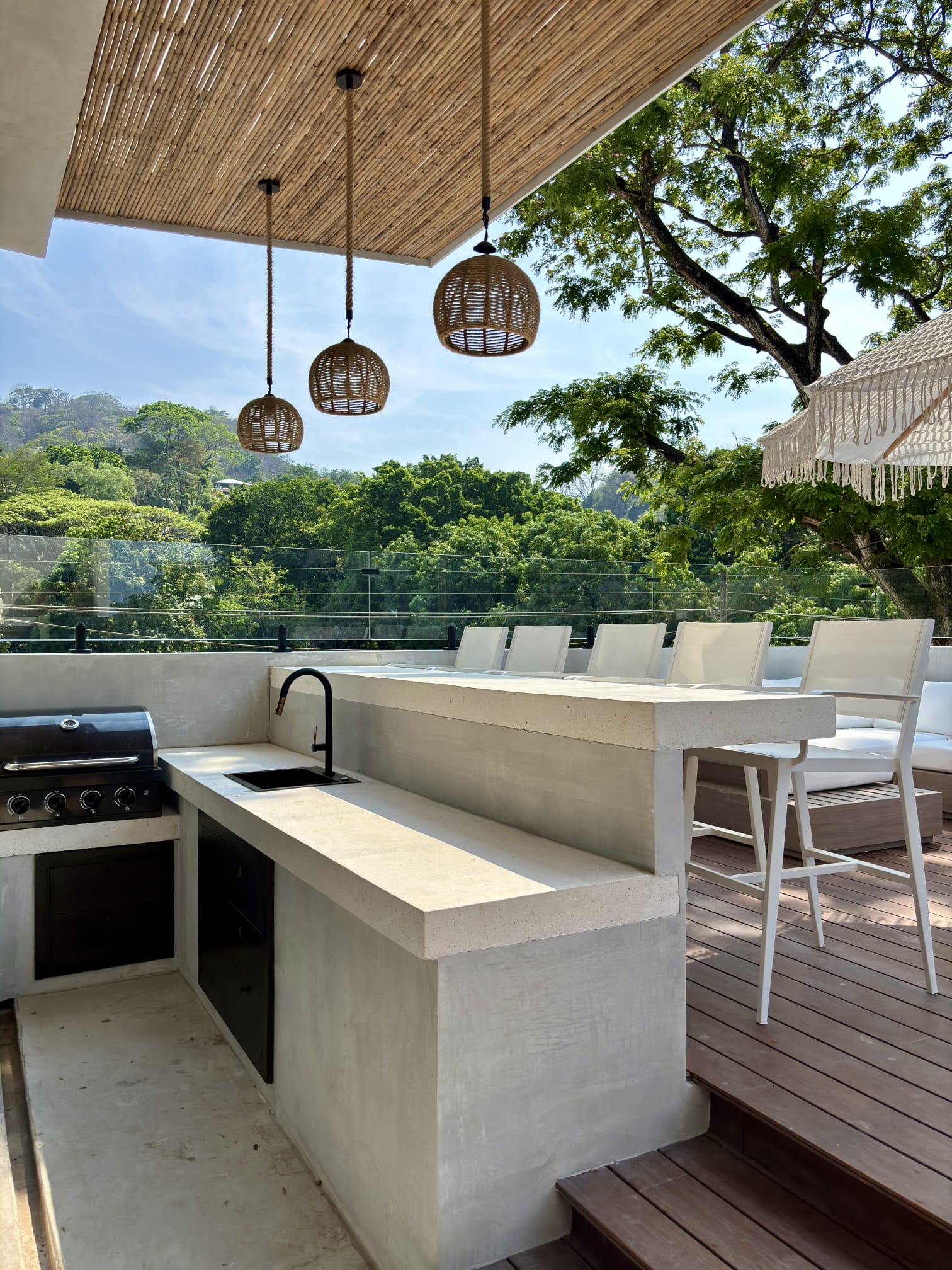 Penthouse outdoor kitchen and bar with bamboo ceiling