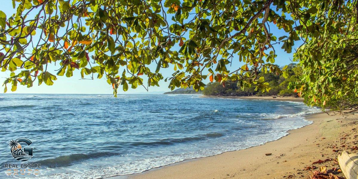 Tranquil Puntarenas beach golden hour - registro nacional property search