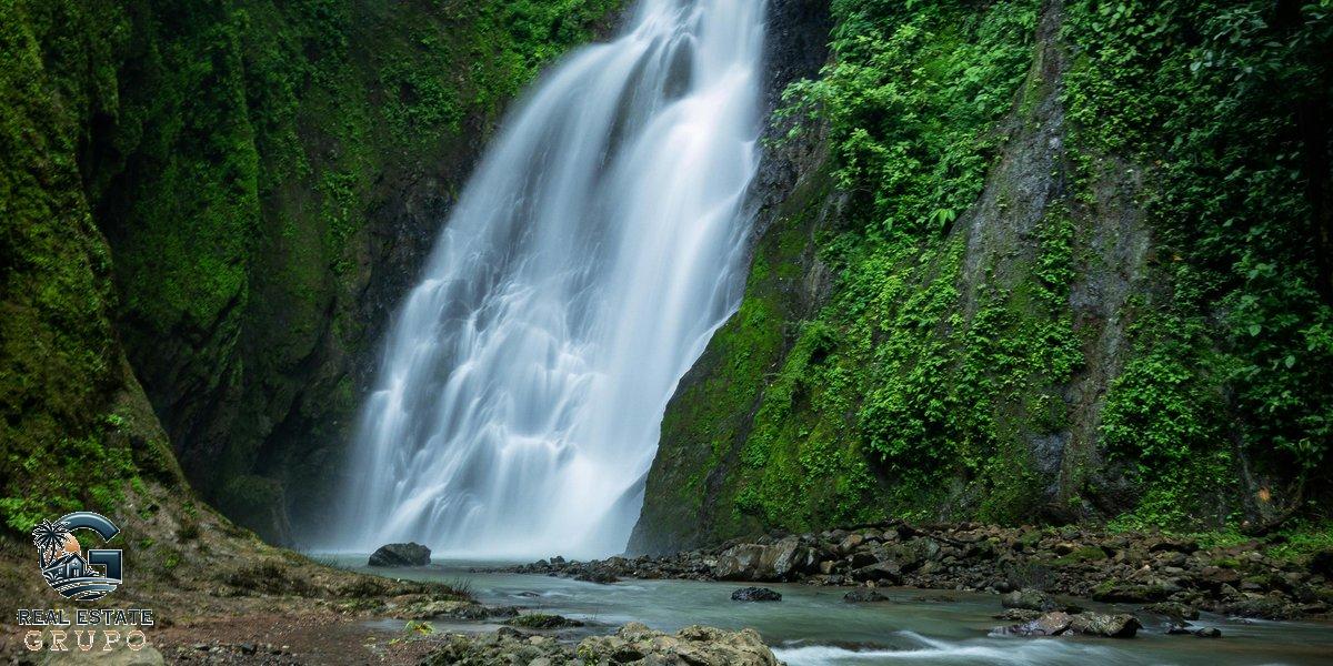 Waterfall in lush forest - costa rica property liens