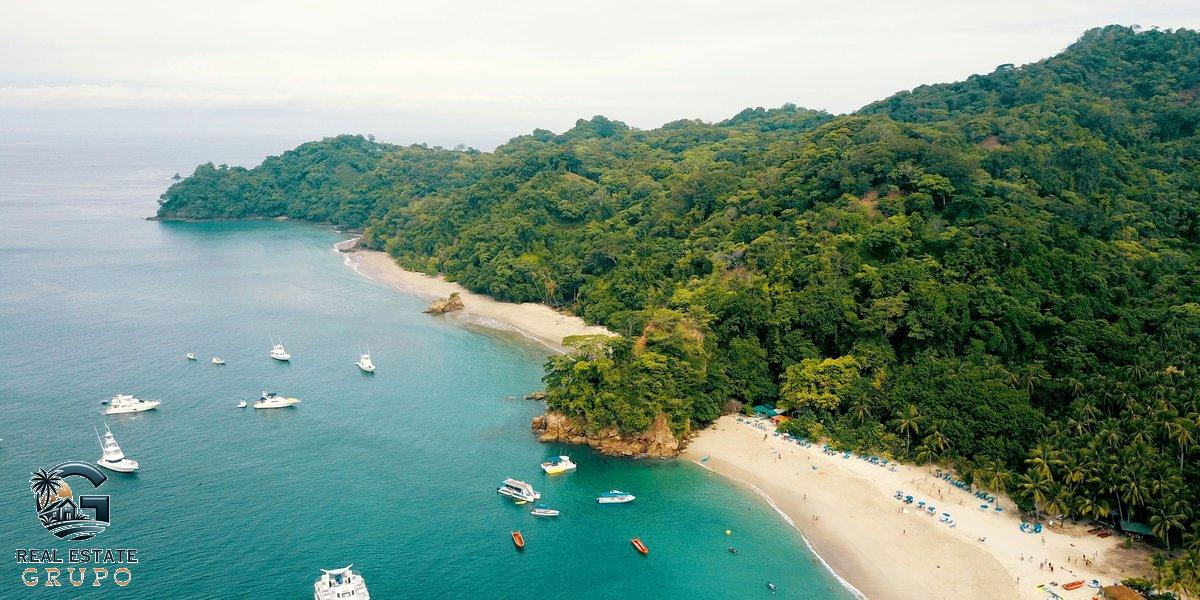 Aerial tropical beach with boats - moving to costa rica rent or buy